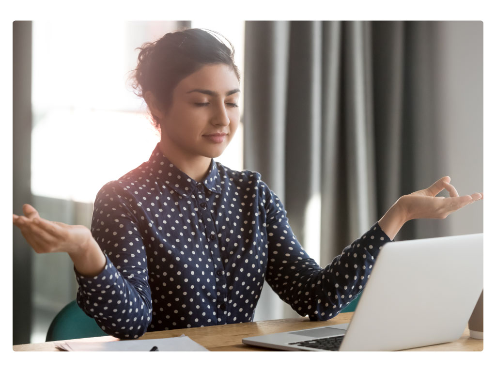 Woman sitting quietly at desk.